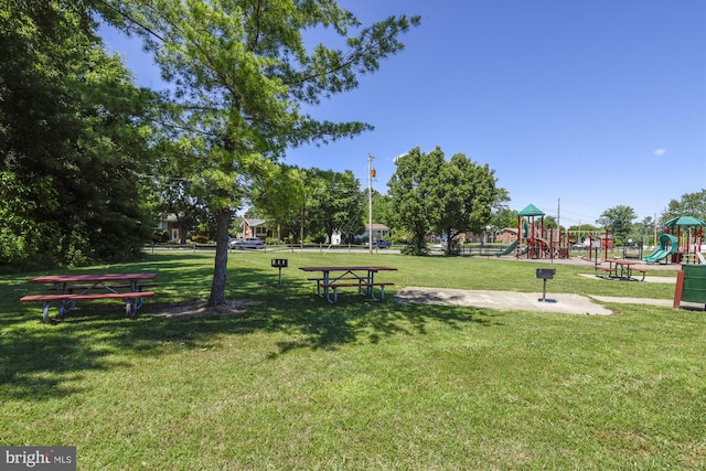 view of property's community with a lawn