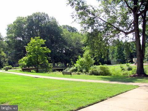 view of home's community featuring a lawn
