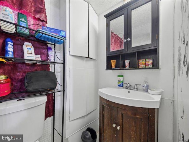half bath with vanity and toilet