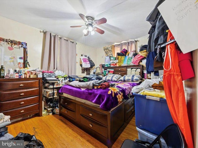 bedroom featuring wood finished floors and ceiling fan
