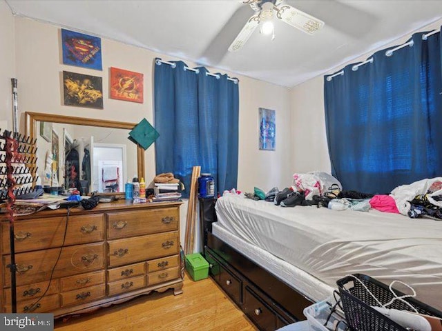 bedroom featuring light wood-type flooring and ceiling fan