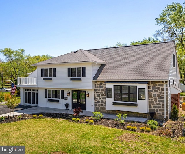 5 Winding Brook Dr, Cinnaminson, NJ 08077 - view of front of home with stone siding, french doors, a front lawn, a balcony, and a patio area