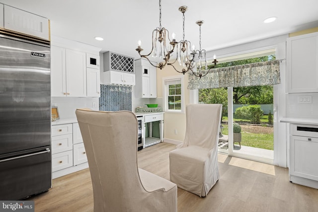 5 Winding Brook Dr, Cinnaminson, NJ 08077 - dining space with a chandelier, recessed lighting, light wood-style flooring, and wine cooler