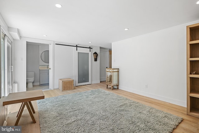 5 Winding Brook Dr, Cinnaminson, NJ 08077 - unfurnished living room with a barn door, light wood-style flooring, recessed lighting, and baseboards