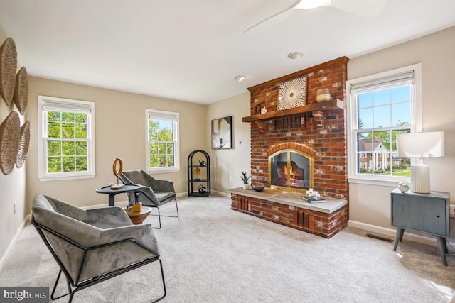 living area featuring baseboards and carpet flooring