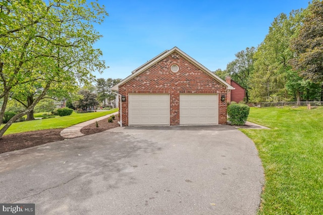 garage with asphalt driveway