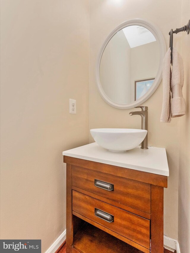 9731 Wyndham Dr, Frederick, MD 21704 - bathroom with vanity and baseboards