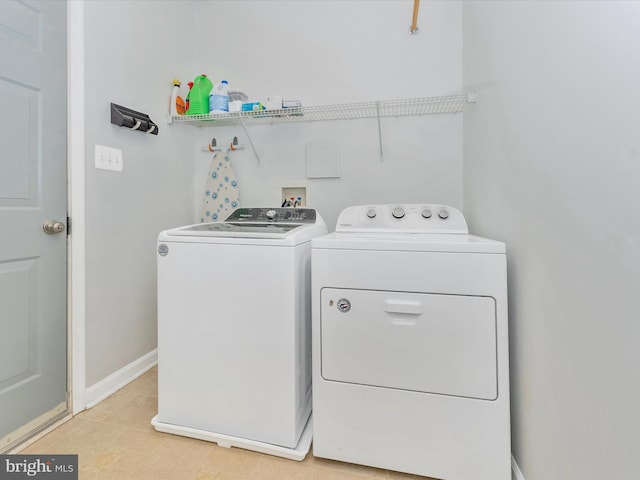 9731 Wyndham Dr, Frederick, MD 21704 - laundry room with independent washer and dryer and baseboards