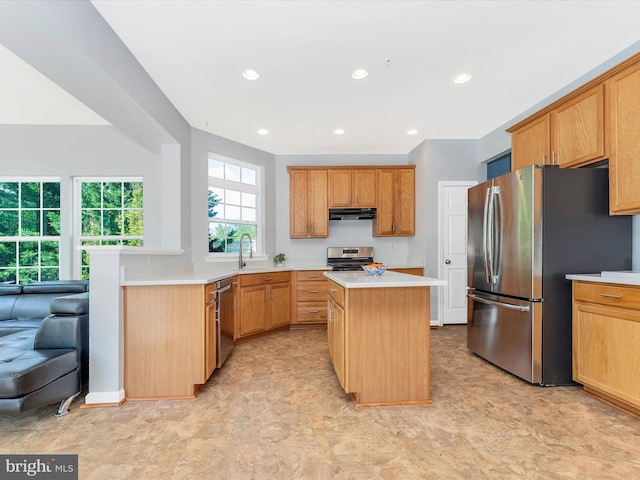 9731 Wyndham Dr, Frederick, MD 21704 - kitchen featuring stainless steel appliances, light countertops, a kitchen island, exhaust hood, and recessed lighting