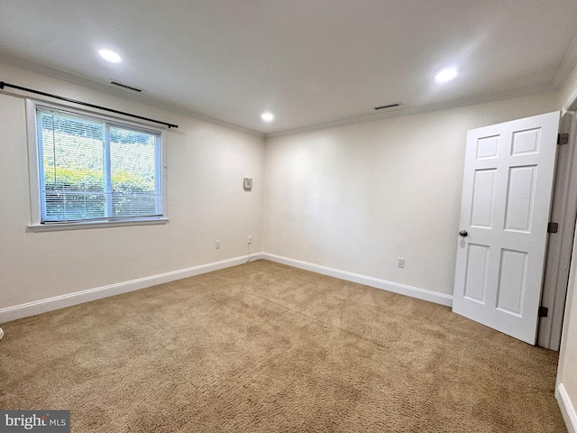carpeted empty room with crown molding, recessed lighting, and baseboards