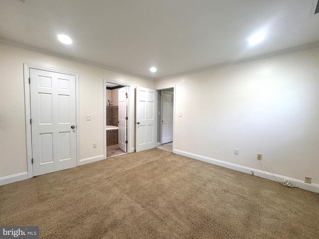 unfurnished bedroom with ornamental molding, light carpet, baseboards, connected bathroom, and recessed lighting