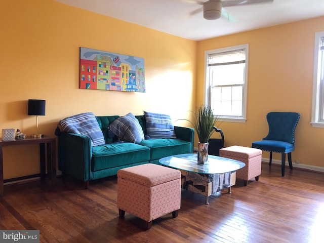 living room with wood finished floors and ceiling fan