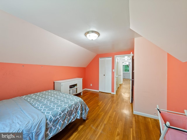 5403 Rolling Rd, Springfield, VA 22151 - bedroom with wood finished floors, baseboards, lofted ceiling, and a closet