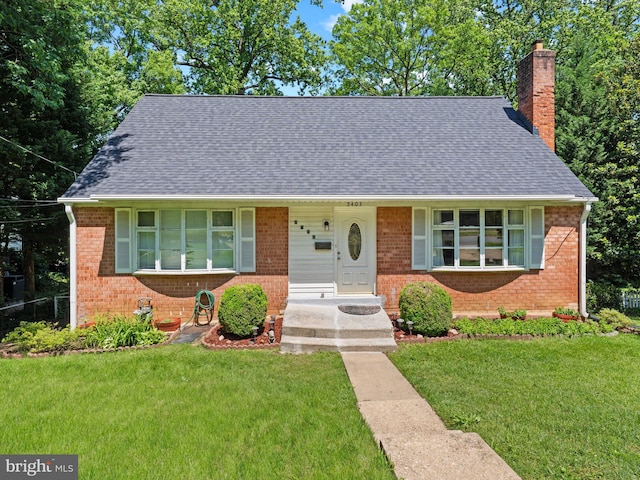 5403 Rolling Rd, Springfield, VA 22151 - view of front of house with a chimney, brick siding, roof with shingles, and a front lawn