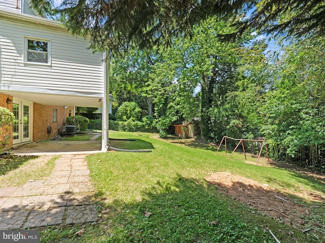 5403 Rolling Rd, Springfield, VA 22151 - view of green lawn with french doors and a patio area