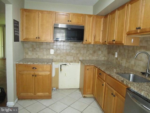 718 Quince Orchard Blvd Unit 718, Gaithersburg, MD 20878 - kitchen with appliances with stainless steel finishes, a sink, light stone countertops, decorative backsplash, and light tile patterned flooring