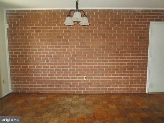 718 Quince Orchard Blvd Unit 718, Gaithersburg, MD 20878 - unfurnished dining area with brick wall