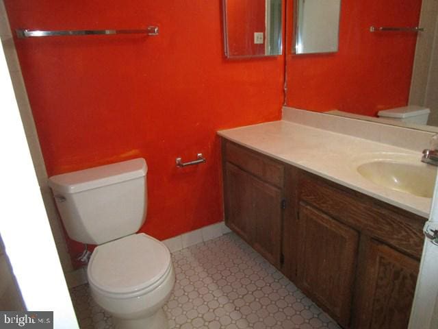 718 Quince Orchard Blvd Unit 718, Gaithersburg, MD 20878 - bathroom featuring toilet, vanity, tile patterned floors, and baseboards