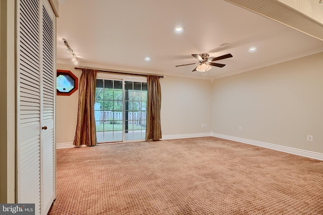 carpeted empty room featuring crown molding, ceiling fan, baseboards, and recessed lighting