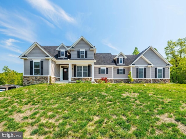 16016 Ambleside Ct, Hughesville, MD 20637 - view of front of property with stone siding, a front lawn, and covered porch
