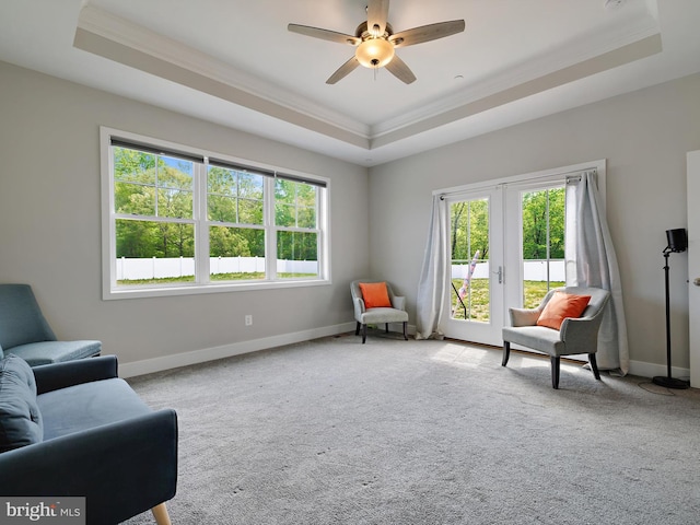 16016 Ambleside Ct, Hughesville, MD 20637 - living area with a raised ceiling, ornamental molding, baseboards, a ceiling fan, and carpet floors