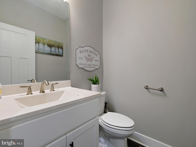 16016 Ambleside Ct, Hughesville, MD 20637 - bathroom featuring vanity, toilet, and baseboards