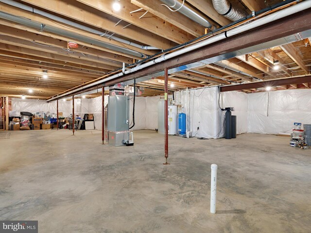 16016 Ambleside Ct, Hughesville, MD 20637 - unfinished basement featuring heating unit, a water pressure tank, and water heater