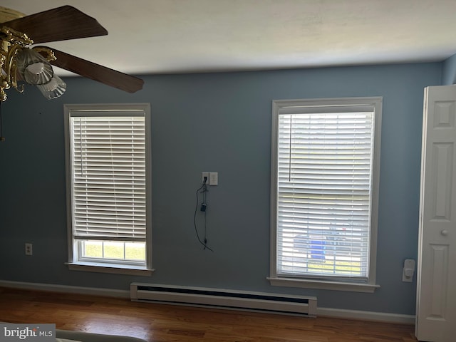 12 Emmit Ct, Emmitsburg, MD 21727 - detailed view of a baseboard radiator, wood finished floors, and baseboards