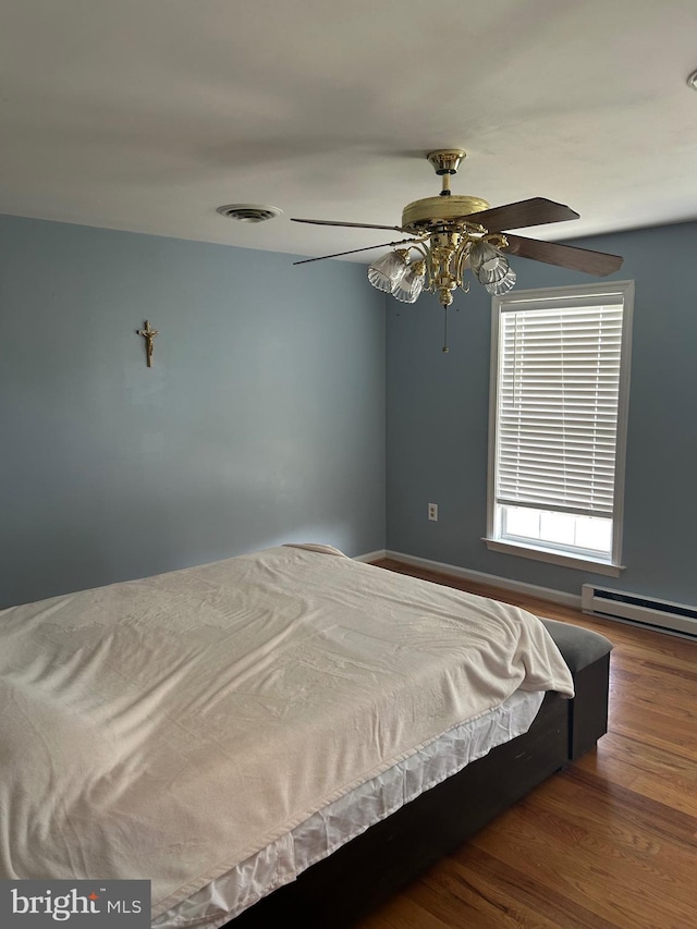 12 Emmit Ct, Emmitsburg, MD 21727 - bedroom with a baseboard radiator, wood finished floors, ceiling fan, and baseboards