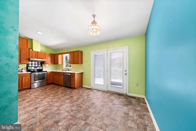 115 Emmitsburg Rd, Thurmont, MD 21788 - kitchen featuring appliances with stainless steel finishes, under cabinet range hood, baseboards, light countertops, and a chandelier