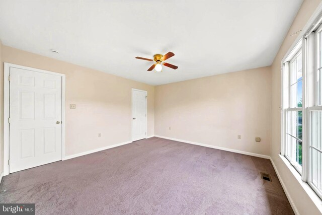 115 Emmitsburg Rd, Thurmont, MD 21788 - spare room with ceiling fan, dark colored carpet, and healthy amount of natural light