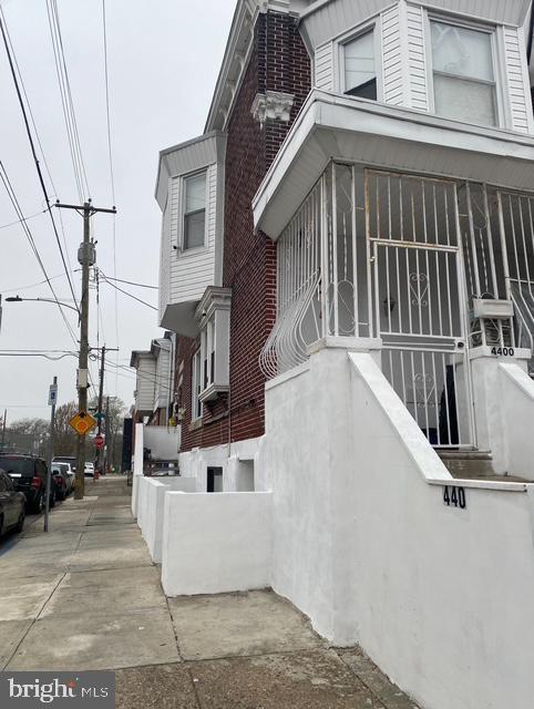 4400 N Franklin St, Philadelphia, PA 19140 - view of home's exterior featuring a sunroom and stucco siding