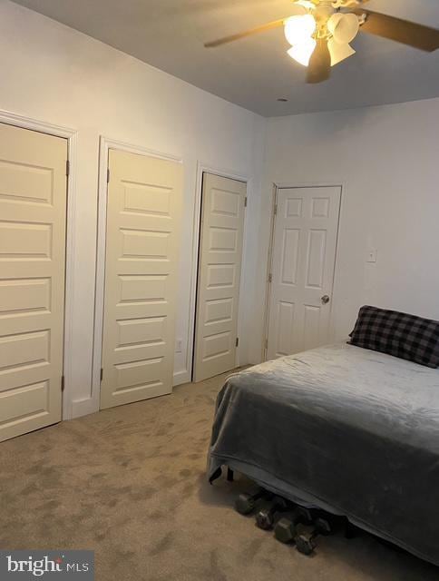 4400 N Franklin St, Philadelphia, PA 19140 - carpeted bedroom featuring two closets and ceiling fan