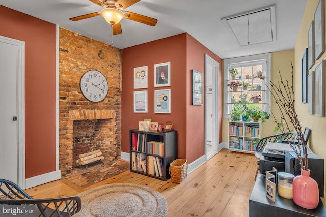 155 E Louther St, Carlisle, PA 17013 - living area with attic access, hardwood / wood-style flooring, ceiling fan, baseboards, and an accent wall
