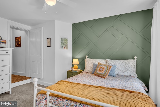 155 E Louther St, Carlisle, PA 17013 - carpeted bedroom with a decorative wall, baseboards, and ceiling fan