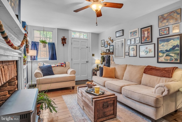 155 E Louther St, Carlisle, PA 17013 - living area featuring a ceiling fan, hardwood / wood-style floors, and a fireplace
