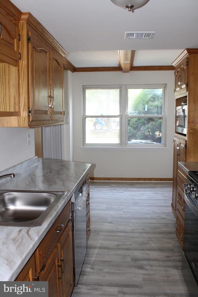 8323 Revelation Ave, Walkersville, MD 21793 - kitchen featuring a sink, appliances with stainless steel finishes, wood finished floors, baseboards, and light countertops