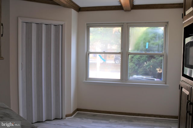 8323 Revelation Ave, Walkersville, MD 21793 - unfurnished dining area featuring light wood finished floors, baseboards, and beamed ceiling