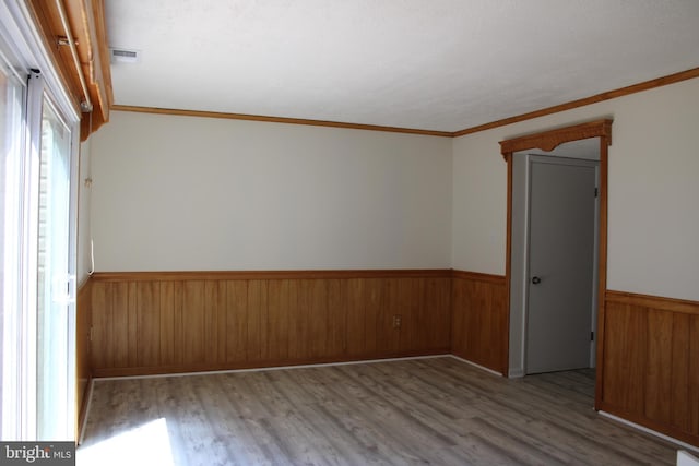 8323 Revelation Ave, Walkersville, MD 21793 - unfurnished room featuring wainscoting, wood finished floors, wood walls, and ornamental molding