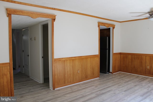 8323 Revelation Ave, Walkersville, MD 21793 - spare room featuring a ceiling fan, a wainscoted wall, wood finished floors, and wood walls