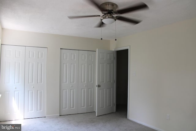 8323 Revelation Ave, Walkersville, MD 21793 - unfurnished bedroom featuring light carpet, multiple closets, baseboards, and ceiling fan