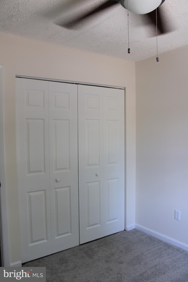 8323 Revelation Ave, Walkersville, MD 21793 - unfurnished bedroom featuring carpet flooring, a closet, a textured ceiling, ceiling fan, and baseboards