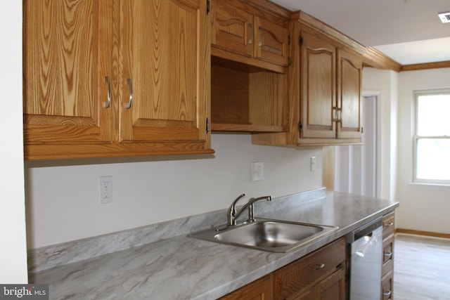 8323 Revelation Ave, Walkersville, MD 21793 - kitchen with dishwasher, a sink, light countertops, and brown cabinets