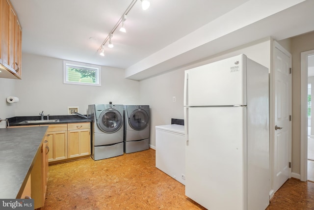 147 Little Quarry Rd, Gaithersburg, MD 20878 - laundry room with a sink, rail lighting, washing machine and dryer, light flooring, and baseboards