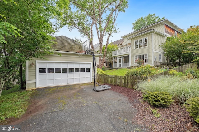 147 Little Quarry Rd, Gaithersburg, MD 20878 - view of front of property with fence, an outbuilding, a balcony, and a detached garage