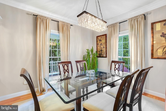 147 Little Quarry Rd, Gaithersburg, MD 20878 - dining space with healthy amount of natural light, a chandelier, baseboards, ornamental molding, and wood finished floors