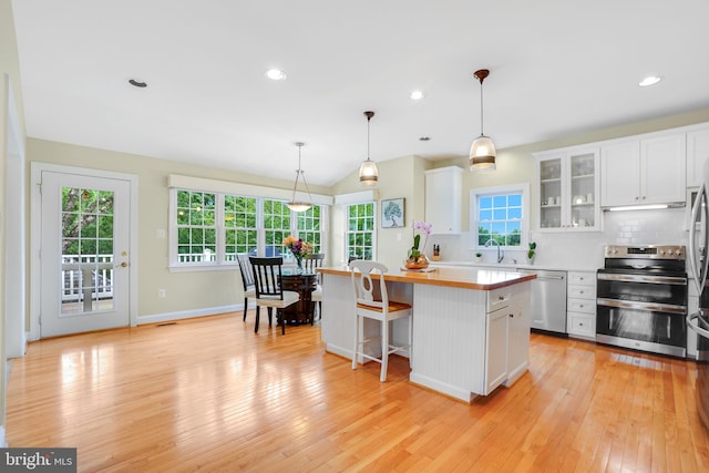 147 Little Quarry Rd, Gaithersburg, MD 20878 - kitchen featuring appliances with stainless steel finishes, light countertops, a center island, white cabinets, and a sink