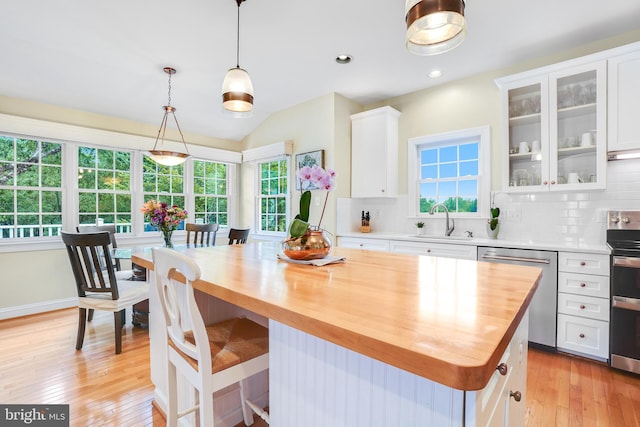 147 Little Quarry Rd, Gaithersburg, MD 20878 - kitchen featuring appliances with stainless steel finishes, wood counters, a sink, white cabinetry, and tasteful backsplash