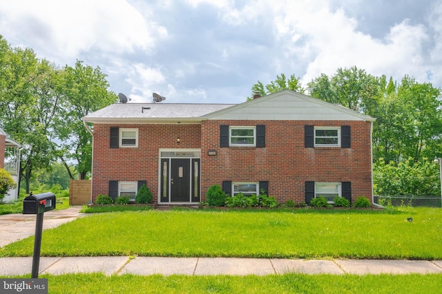 split foyer home with brick siding
