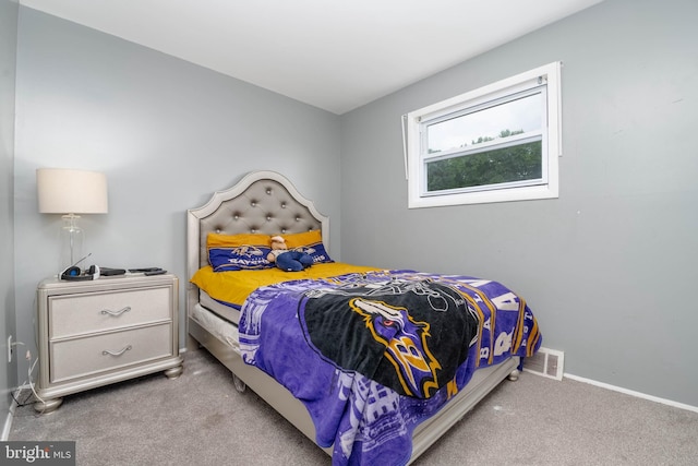 carpeted bedroom with baseboards